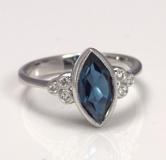 Lady's White 14 Karat Contemporary Fashion Ring Size 7 With One 13.00X6.50Mm Marquise Blue Topaz And 6=0.06Tw Round Diamonds